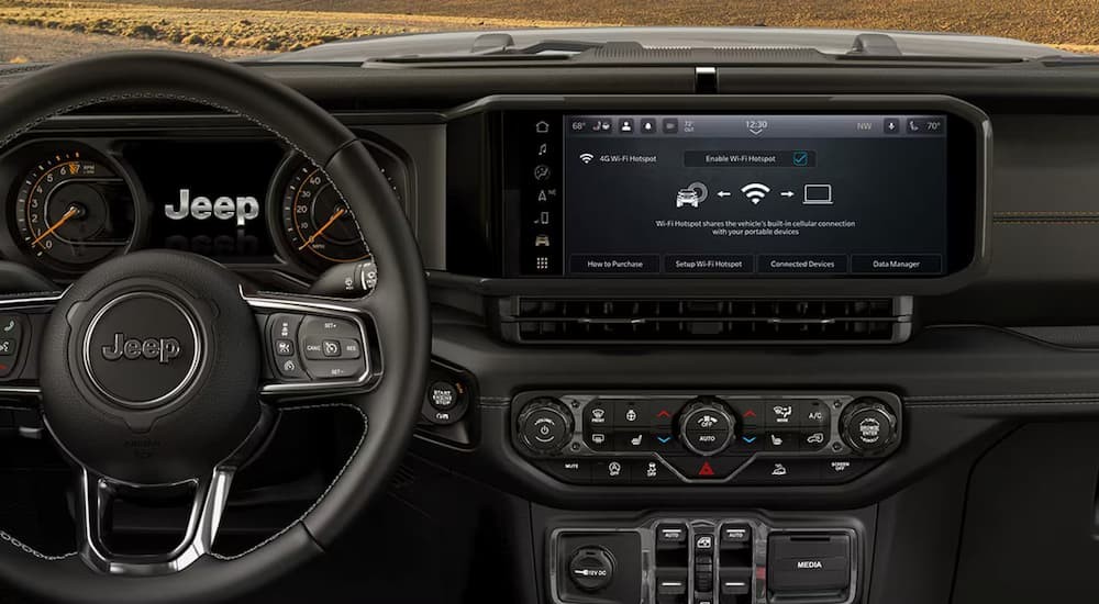 Close-up of the black dash in a 2026 Jeep Wrangler.