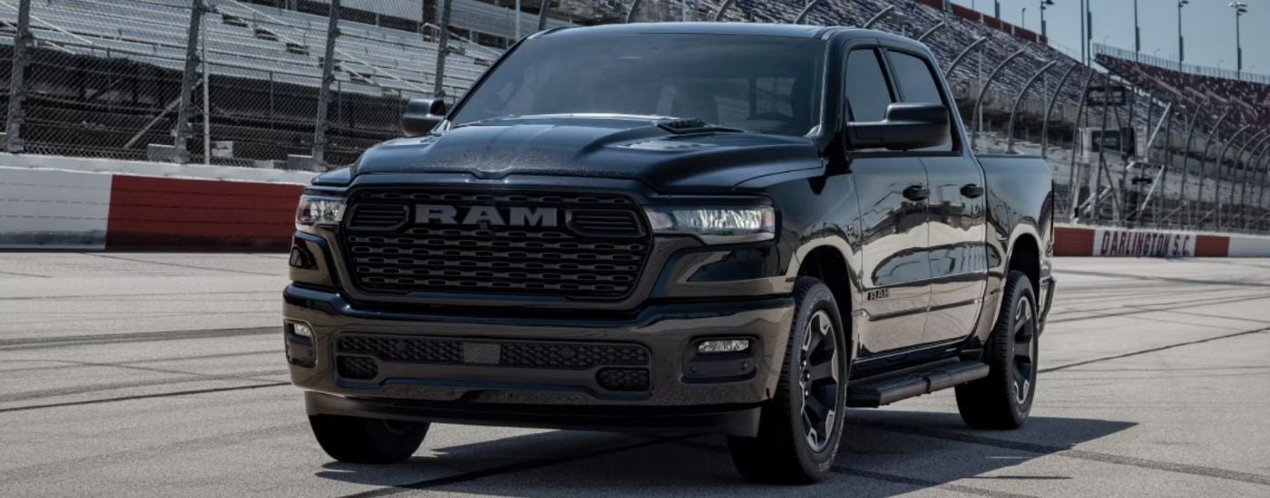 Black 2026 Ram 1500 Black Express on a racetrack.