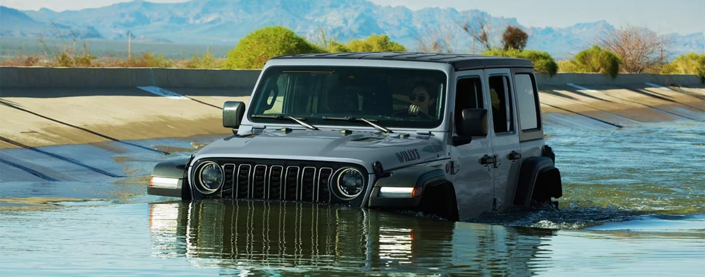 Grey 2026 Jeep Wrangler Willy's trim driving while under water.