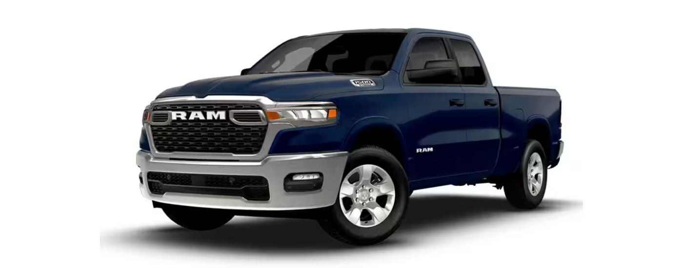The blue 2026 Ram 1500 Big Horn angled left.