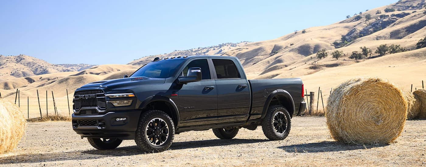 Side of a grey 2026 Ram 2500 parked off-road.