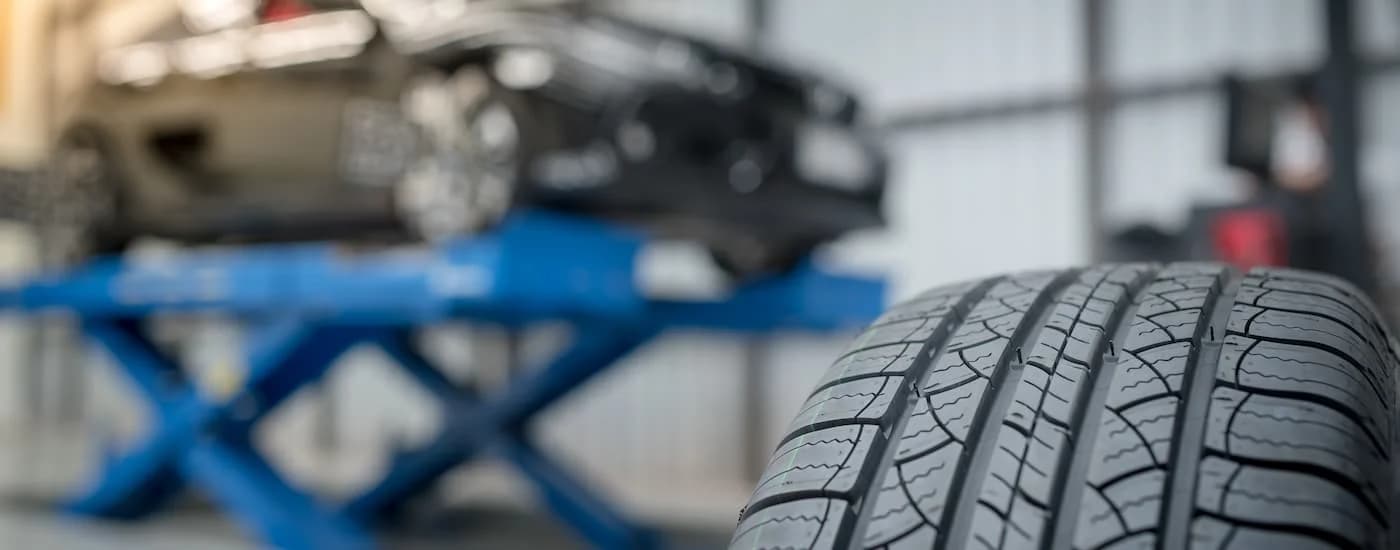 Close-up on the treads on top of a tire.